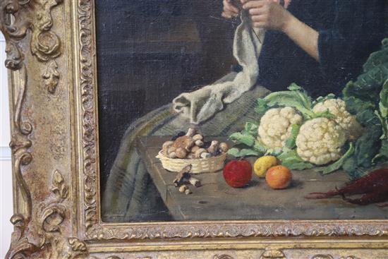 19th Century English School Interior with woman knitting and vegetables on a table top 15 x 11in.